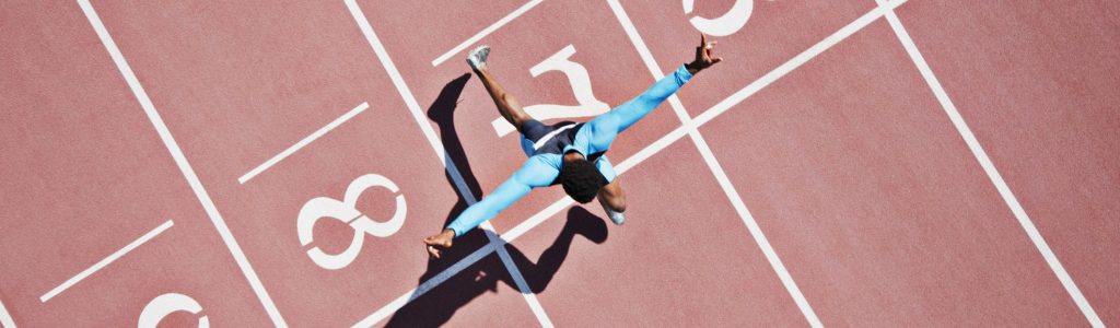 Runner crossing finishing line on track