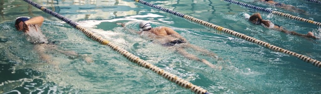 People swimming in a swimming competition